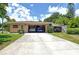 Two-car garage with ample space for vehicles and storage at 3225 Duncan Way, Sarasota, FL 34239
