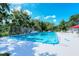 Community pool with surrounding patio furniture at 3225 Duncan Way, Sarasota, FL 34239