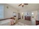 Comfortable bedroom showcasing a bed, dresser, and ensuite bathroom offering both style and functionality at 6722 Oakmont Way, Lakewood Ranch, FL 34202