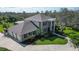 Aerial view of home with a large yard, three-car garage and a view of the upper deck at 6722 Oakmont Way, Lakewood Ranch, FL 34202