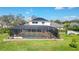 Aerial view of the home showing solar panels, backyard, pool and outdoor area at 6722 Oakmont Way, Lakewood Ranch, FL 34202