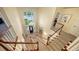 Grand foyer showcasing a staircase, chandelier, and large window for ample natural lighting at 6722 Oakmont Way, Lakewood Ranch, FL 34202