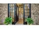 Grand front entryway showcases an elegant front door, interior staircase, and detailed brickwork at 6722 Oakmont Way, Lakewood Ranch, FL 34202