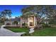 Stunning two-story brick home featuring a manicured lawn, elegant columns, and a grand entrance at 6722 Oakmont Way, Lakewood Ranch, FL 34202
