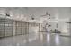 Spacious three-car garage with epoxy flooring, ample storage, and great lighting at 6722 Oakmont Way, Lakewood Ranch, FL 34202