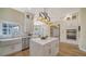 Elegant kitchen featuring white cabinets, a center island with seating, and stainless steel appliances at 6722 Oakmont Way, Lakewood Ranch, FL 34202