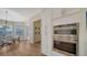 Bright kitchen features stainless steel appliances, hardwood floors, and views into dining room at 6722 Oakmont Way, Lakewood Ranch, FL 34202