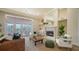 Sun-filled living room with fireplace, piano, French doors to the pool, and neutral decor at 6722 Oakmont Way, Lakewood Ranch, FL 34202
