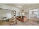 Comfortable living room with views to entry, kitchen, and sitting area at 6722 Oakmont Way, Lakewood Ranch, FL 34202