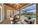 Covered patio area with furniture overlooking pool and backyard at 6722 Oakmont Way, Lakewood Ranch, FL 34202