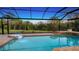 Relaxing pool with a view of lush greenery and a serene spa at 6722 Oakmont Way, Lakewood Ranch, FL 34202