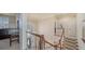 Open staircase design with carpeted stairs, wooden banister, and bright lighting from a large window at 6722 Oakmont Way, Lakewood Ranch, FL 34202