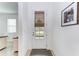 Bright entryway with white door and neutral-toned flooring at 5311 Coral Reef Way, Bradenton, FL 34211