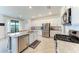 Modern kitchen with large island and stainless steel appliances at 5311 Coral Reef Way, Bradenton, FL 34211