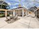 Spacious screened patio with seating area, perfect for outdoor entertaining at 424 Cardiff Rd # 27, Venice, FL 34293