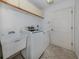 Functional laundry room with washer, dryer, and utility sink at 424 Cardiff Rd # 27, Venice, FL 34293