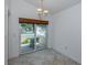 Small breakfast nook with sliding door access to a private patio at 424 Cardiff Rd # 27, Venice, FL 34293