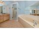 Light and bright bathroom with a soaking tub and walk-in shower at 424 Cardiff Rd # 27, Venice, FL 34293