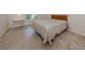 Comfortable bedroom with tile flooring and neutral color scheme at 424 Cardiff Rd # 27, Venice, FL 34293