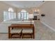 Open living room with a fireplace, large windows and tiled floors at 424 Cardiff Rd # 27, Venice, FL 34293