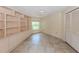 Spacious bedroom with built-in shelving and tile flooring at 424 Cardiff Rd # 27, Venice, FL 34293