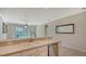Kitchen features a double sink and a view into the living and dining area at 11415 52Nd E Ct, Parrish, FL 34219