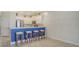 Kitchen boasts stainless steel appliances and a breakfast bar with blue accents at 11415 52Nd E Ct, Parrish, FL 34219