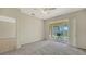 Bedroom with sliding glass doors opening to a private patio at 11415 52Nd E Ct, Parrish, FL 34219