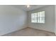 Bright bedroom with carpeted floors and large window at 11415 52Nd E Ct, Parrish, FL 34219