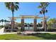 Brick pillars and pergola entryway to a community pool at 11415 52Nd E Ct, Parrish, FL 34219