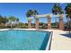 Sparkling community pool with brick coping and lounge chairs at 11415 52Nd E Ct, Parrish, FL 34219