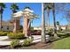Brick gazebo with pergola and seating area in a lush, landscaped community setting at 11415 52Nd E Ct, Parrish, FL 34219