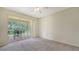 Spacious bedroom with sliding glass doors leading to a private patio at 11415 52Nd E Ct, Parrish, FL 34219