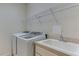 Laundry room with washer, dryer, and utility sink at 11415 52Nd E Ct, Parrish, FL 34219