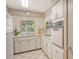 Bright and efficient kitchen with white cabinets and updated appliances at 3225 Duncan Way, Sarasota, FL 34239