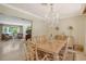 Bright dining room with chandelier and large table, offering ample seating at 3225 Duncan Way, Sarasota, FL 34239