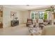 Living room with brick accent wall and comfortable seating at 3225 Duncan Way, Sarasota, FL 34239