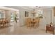 Elegant dining room with chandelier and French doors to backyard at 3225 Duncan Way, Sarasota, FL 34239