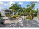 Scenic garden and backyard view from the dock with outdoor seating, with lush landscaping at 4343 Pompano Ln, Palmetto, FL 34221