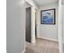 Hallway view, showing the bedroom and a painting of a fish on the wall at 4343 Pompano Ln, Palmetto, FL 34221