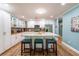 Modern kitchen featuring white cabinets, granite countertops, and stainless steel appliances at 5911 Braden Run, Bradenton, FL 34202