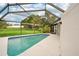 Relaxing screened-in pool area, perfect for outdoor enjoyment at 907 E Rosedale Rd, Venice, FL 34293