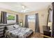 Bright bedroom with a double bed and gray bedding at 907 E Rosedale Rd, Venice, FL 34293