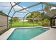 Inviting screened-in pool with a large backyard at 907 E Rosedale Rd, Venice, FL 34293