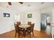 Cozy dining area with glass-top table and four chairs at 907 E Rosedale Rd, Venice, FL 34293