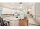Efficient kitchen featuring white cabinets and a U-shaped counter at 907 E Rosedale Rd, Venice, FL 34293