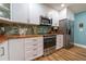 Modern kitchen with butcher block countertops and stainless steel appliances at 5911 Braden Run, Bradenton, FL 34202