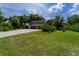 Detached two-car garage with a barn-style roof at 5911 Braden Run, Bradenton, FL 34202