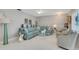 Cozy living room boasts a teal sectional and accent chairs at 2323 Waterbluff Pl # V314, Sarasota, FL 34231