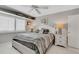 Main bedroom with a comfortable bed, nightstands, and ceiling fan at 2323 Waterbluff Pl # V314, Sarasota, FL 34231